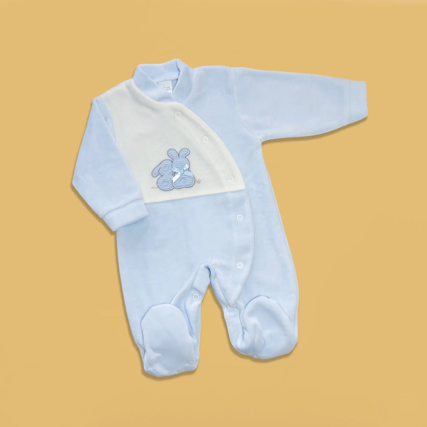 Babygrow com motivo coelhos tricot com lacinho azul