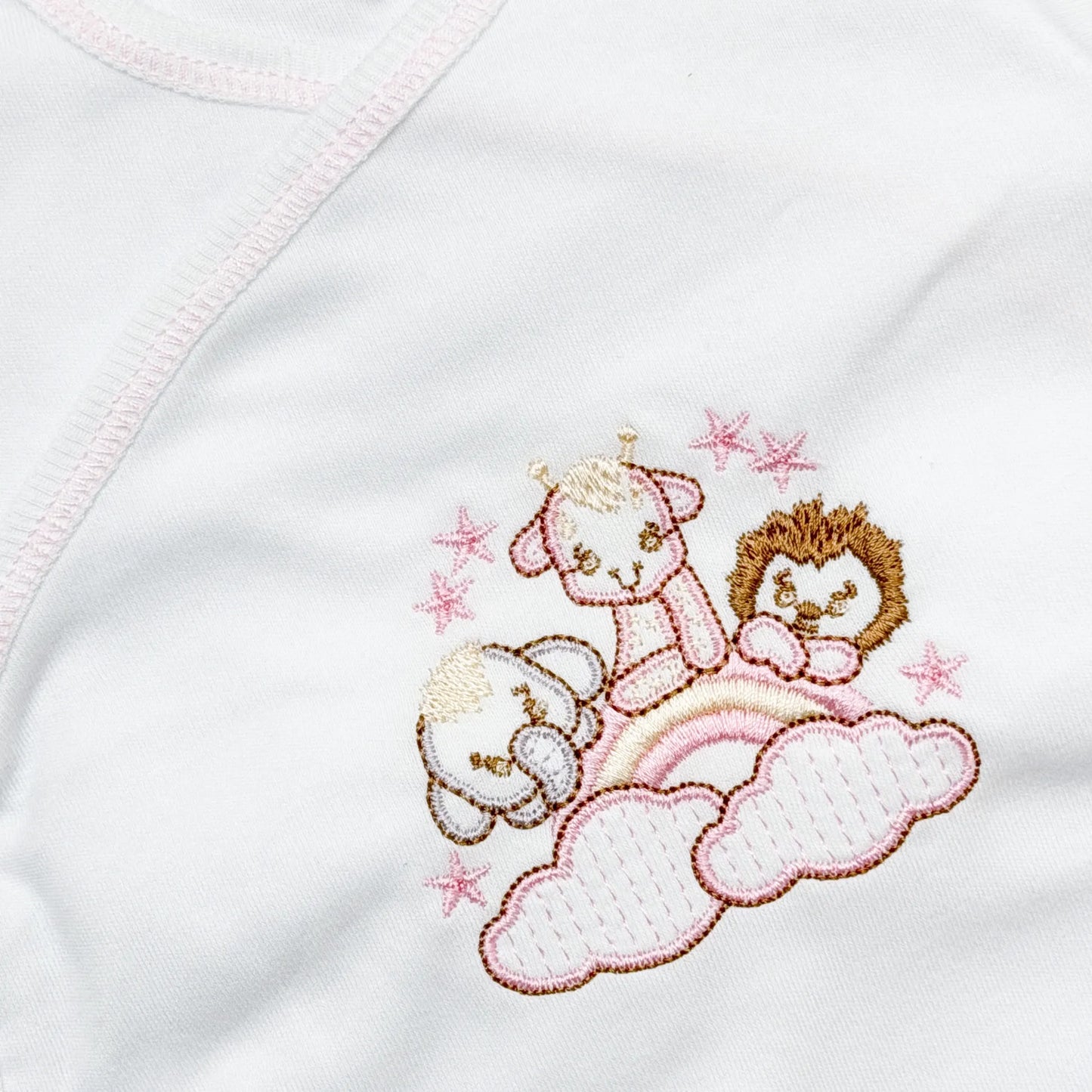 Pormenor de body de trespasse com collant com motivo animais no arco-íris rosa