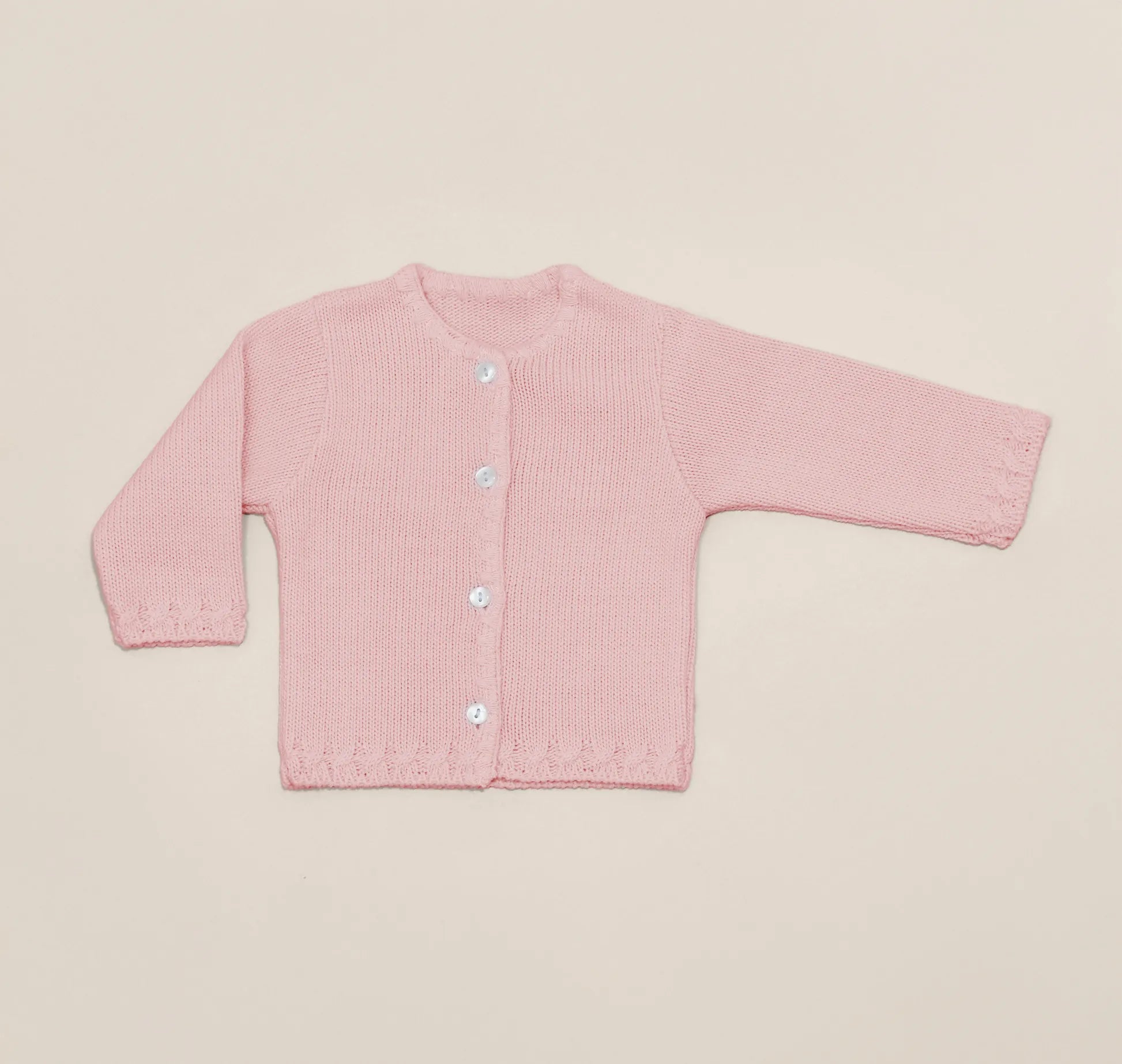 Casaco em tricot com pormenores trabalhados nas extremidades rosa