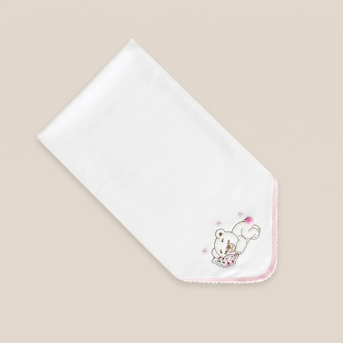 Fralda com motivo ursinho deitado com pompom rosa