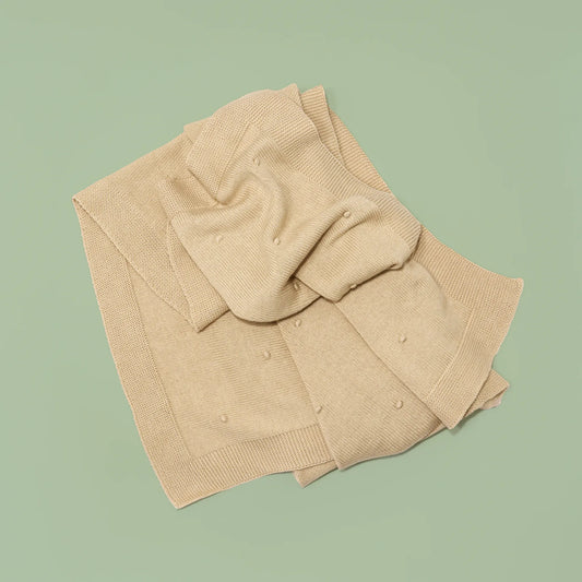 Manta em tricot com relevo de pompons bege